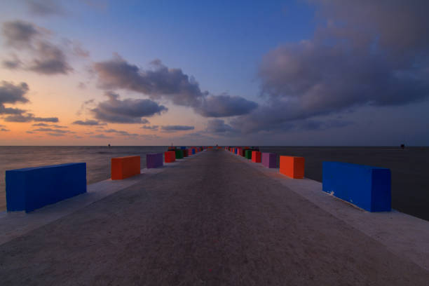 istock cement bridge at the sea 937440272