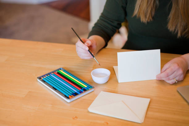 istock Young Woman Making Cards 937442794