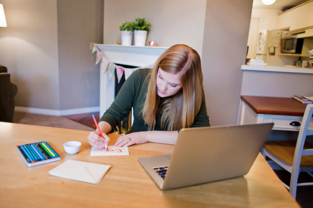 istock Young Woman Making Cards 937442888