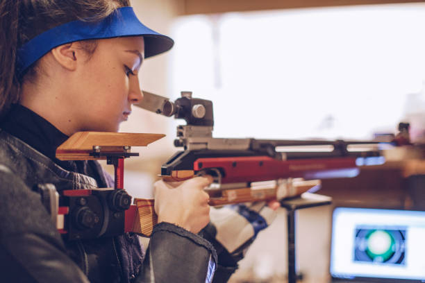 istock Girl sport shooter practicing 937443656