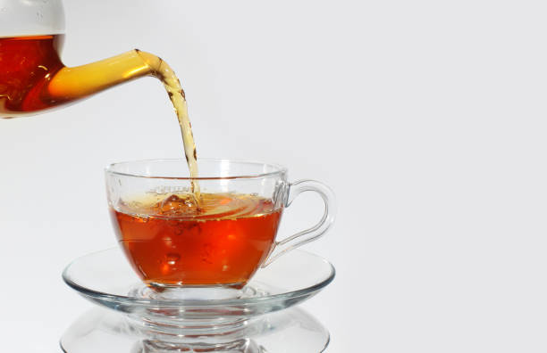 istock Pouring tea to a teacup 937446866