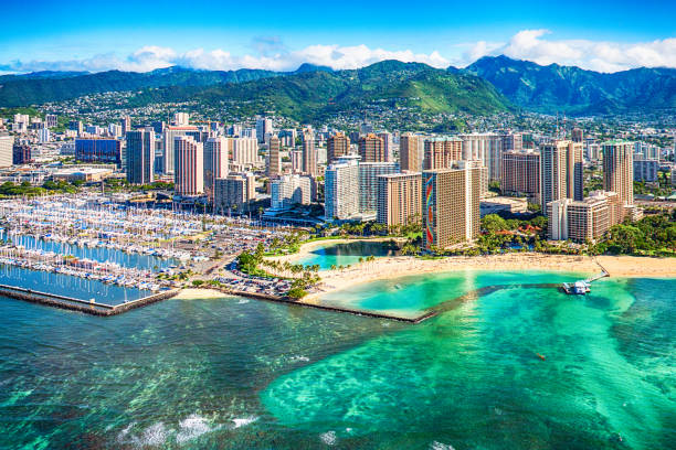 Honolulu Cityscape Aerial Downtown Honolulu on Oahu, Hawaii shot from an altitude of about 1000 feet over the Pacific Ocean. honolulu stock pictures, royalty-free photos & images