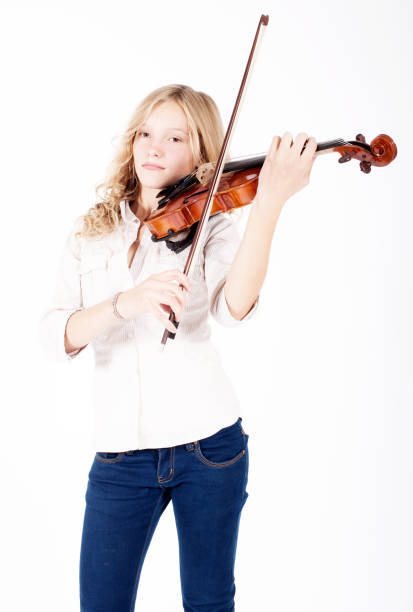 istock young blond girl playing the violin 937467506