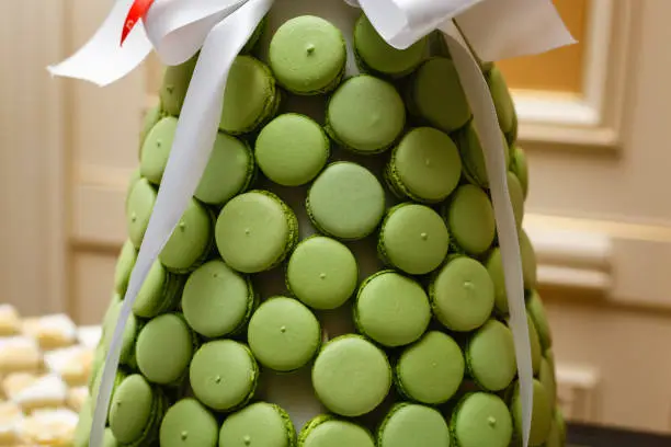 Pistachio macaroons with red ribbon