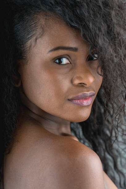 istock Stunning black woman looking very pensive at the camera 937486936