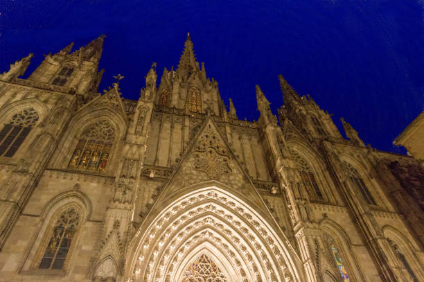 istock The cathedral of Barcelona in the evening, low angle view 937498852