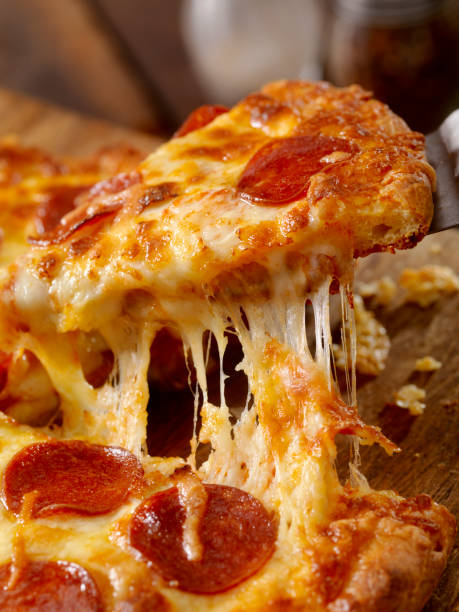 cheesy pepperoni pizza - take out food fast food vertical tomato imagens e fotografias de stock