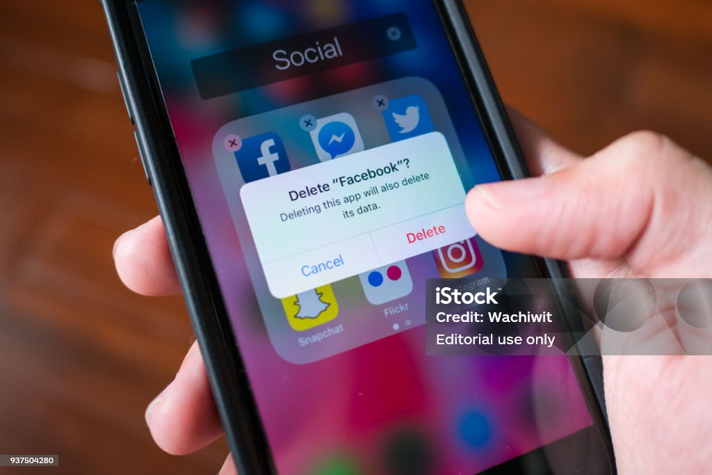 Facebook user deleting Facebook application on iPhone 7. Bangkok, Thailand - March 23, 2018 : Facebook user deleting Facebook application on iPhone 7. Social Media Stock Photo Facebook user deleting Facebook application on iPhone 7. Bangkok, Thailand - March 23, 2018 : Facebook user deleting Facebook application on iPhone 7. Social Media Stock Photo