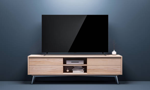 smart tv mockup mit schwarzen hochglanz-bildschirm auf konsole im wohnzimmer - television stand stock-fotos und bilder