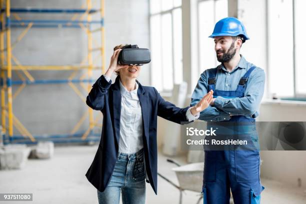 Woman Client Wearing Vr Glasses At The Construction Site Stock Photo - Download Image Now