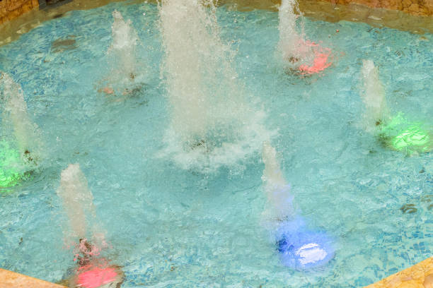 Working LED fountain with bright clear azure water