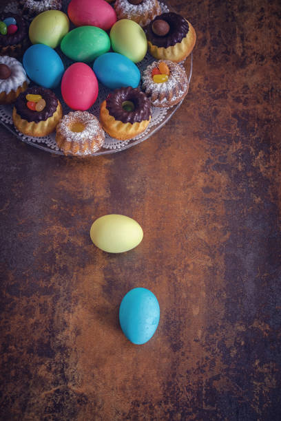 istock Colorful Easter Eggs Decoration on Wooden Background 937522444