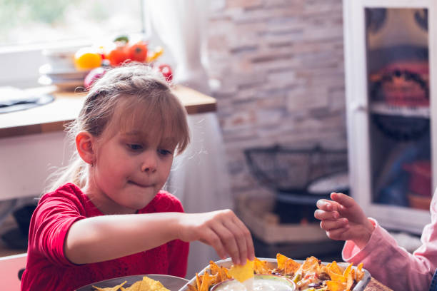 istock Eating Mexican Tacos with Spicy Salsa and Nacho Tortilla Chips 937522466