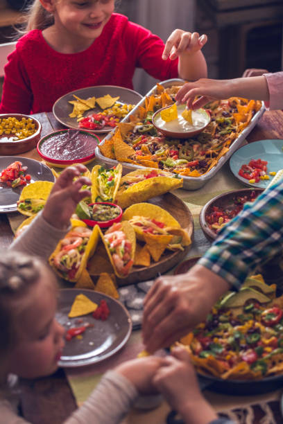 istock Eating Mexican Tacos with Spicy Salsa and Nacho Tortilla Chips 937522502