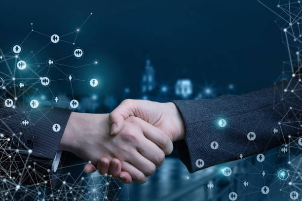 istock Handshake on the background of night streets . 937523666