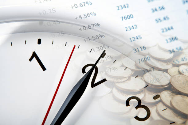 istock clock face and Russian ruble coins and digits closeup 937526844