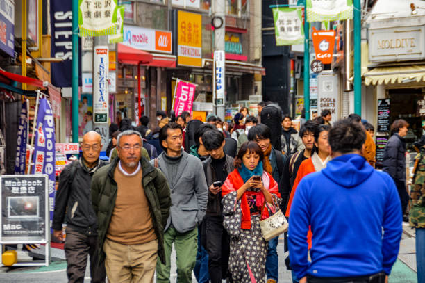 istock Crowded daytime street scene in Tokyo, Japan 937534134