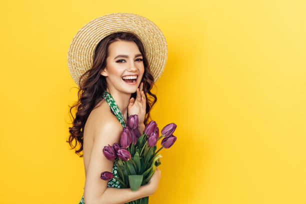 istock Lovely woman with purple tulips bunch 937536832