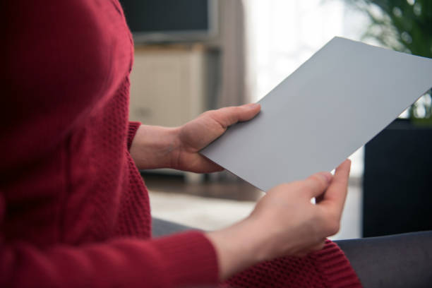 istock Looking at a blank paper brochure with copy space 937542294