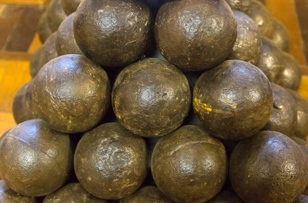 istock cannonball painted in dark paint piled in a pyramid style wallpaper background millitari 937543424