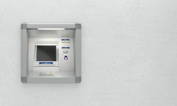 Atm machine on wall stock photo