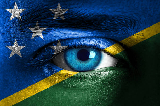 istock Human face painted with flag of Solomon Islands 937547654