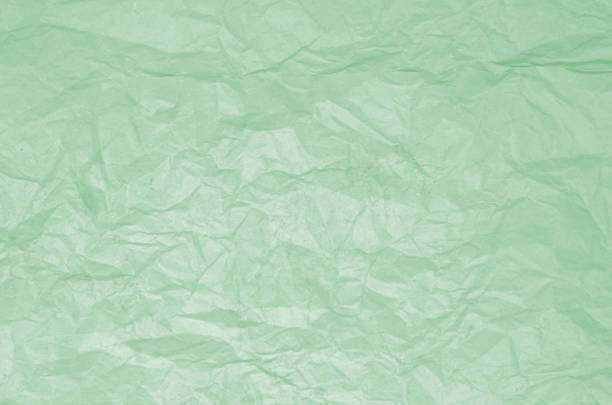 istock Dirty texture of old crumpled light green paper 937550666