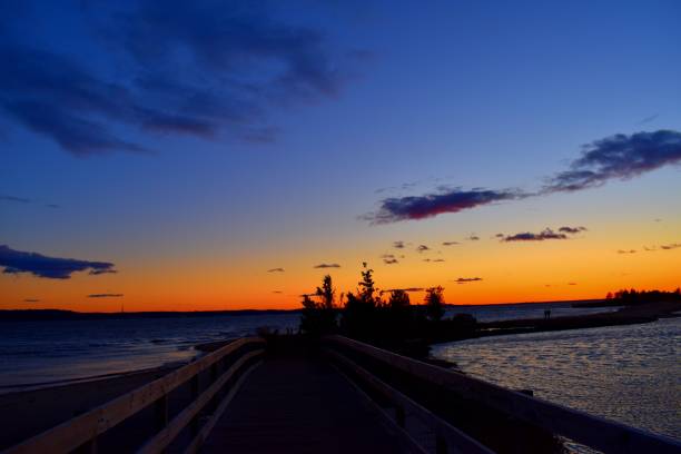 istock Bridge in to the sea during sunset 937556536