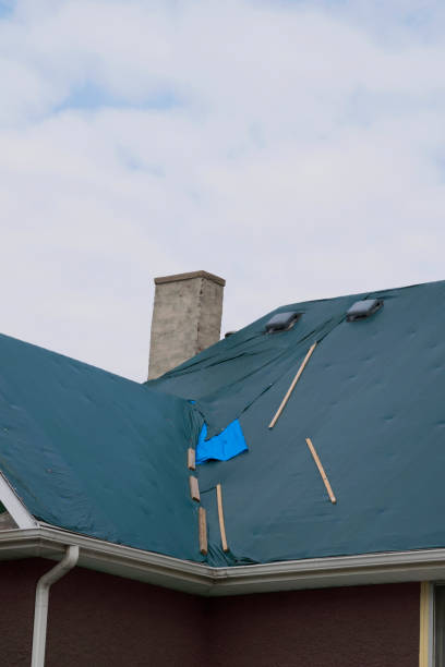 istock Damaged and old roofing shingles on a house 937559438