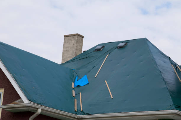 istock Damaged and old roofing shingles on a house 937559454