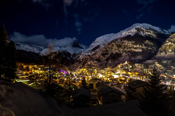 istock Beautiful Zermatt glows at night under a clear sky with matter horn covered in snow 937565128