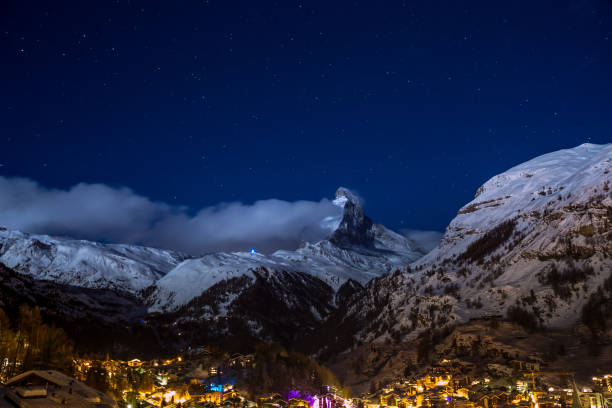 istock Beautiful Zermatt glows at night under a clear sky with matter horn covered in snow 937565140