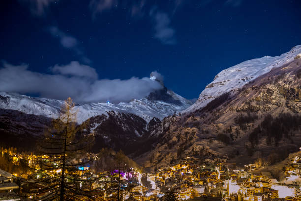 istock Beautiful Zermatt glows at night under a clear sky with matter horn covered in snow 937565150