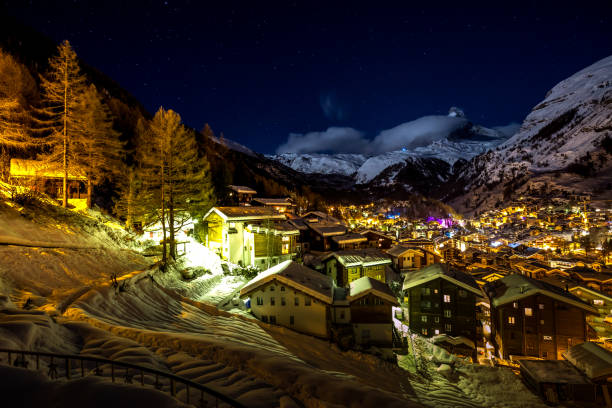 istock Beautiful Zermatt glows at night under a clear sky with matter horn covered in snow 937565152