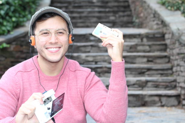 istock Guy listening to Stereo cassette Walkman 937568402