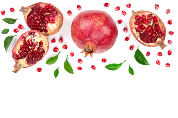 istock pomegranate with leaves isolated on white background with copy space for your text. Top view. Flat lay pattern 937568666