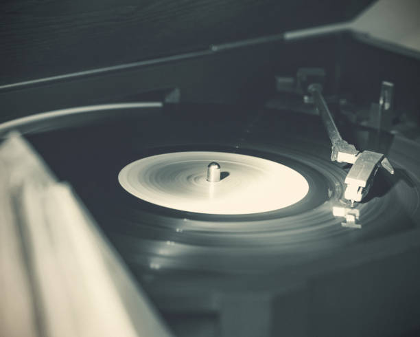 istock Music from a Vintage 33 RPM LP Record Playing on a Turntable 937571376