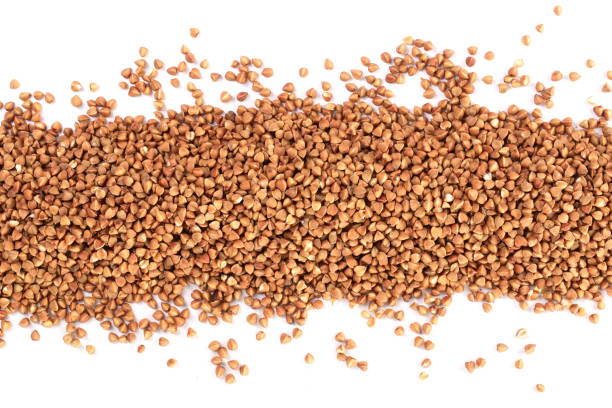 istock buckwheat grain isolated on white background close up. Top view 937579594