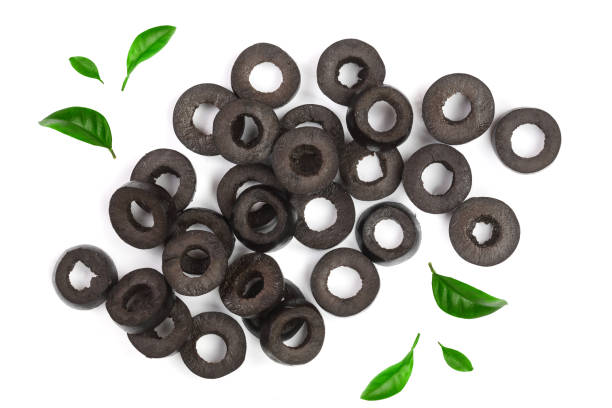 istock sliced black olives decorated with leaves isolated on white background. Top view. Flat lay pattern 937584552