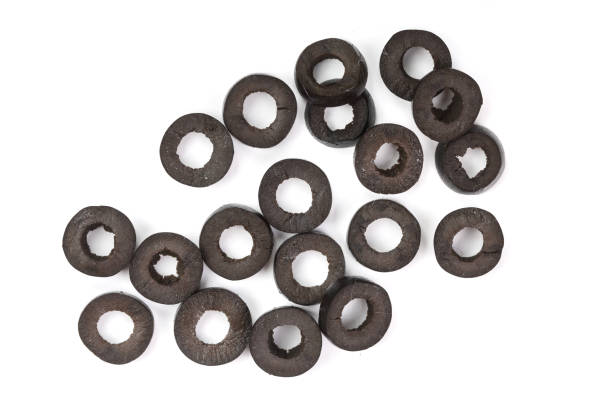istock sliced black olives isolated on white background. Top view. Flat lay pattern 937584600