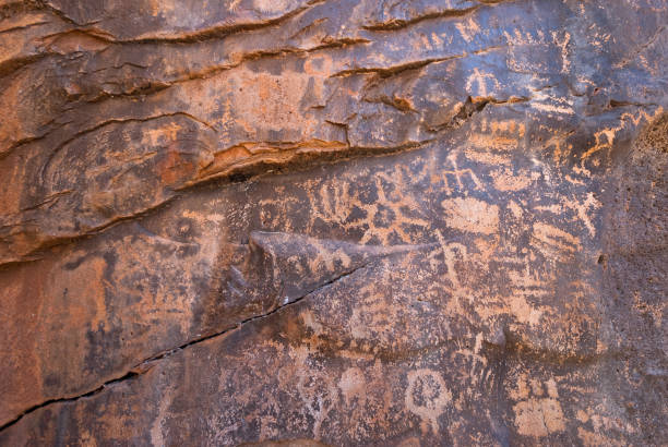 Petroglyphs at Keyhole Sink Keyhole Sink is a canyon known for its petroglyphs, which were created between 700 and 1100CE by the ancient Cohonina people. It is also known for the seasonal waterfall that flows into the canyon. Keyhole Sink is located in the Kaibab National Forest near Williams, Arizona, USA. jeff goulden southwest usa stock pictures, royalty-free photos & images
