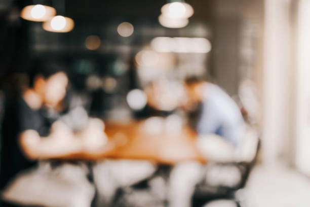 istock blur image background of office or co working space with people 937590114