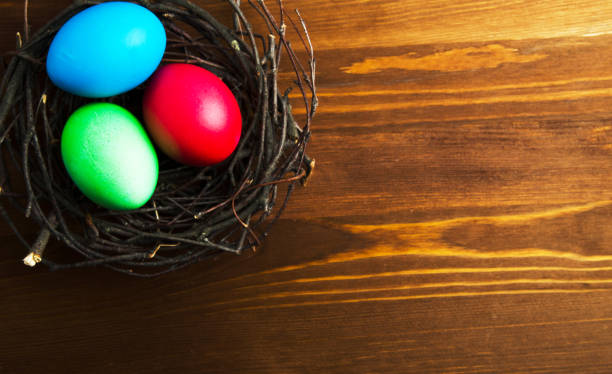 istock Easter eggs on a wooden background .Easter eggs of different colors .Easter eggs top view 937598420