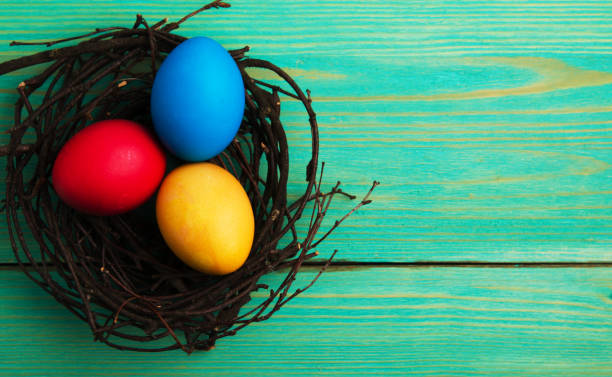 istock Easter eggs on a wooden background .Easter eggs of different colors .Easter eggs top view 937598422