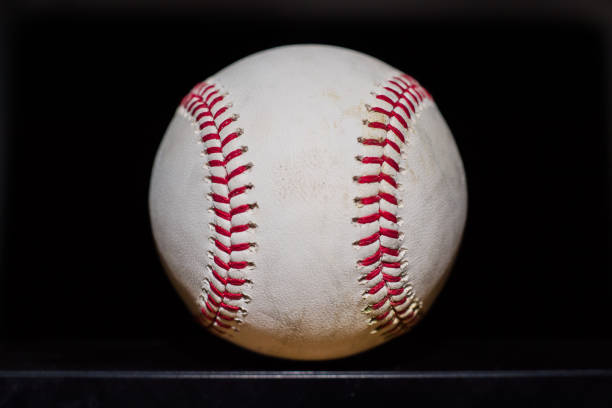 guy handing a baseball