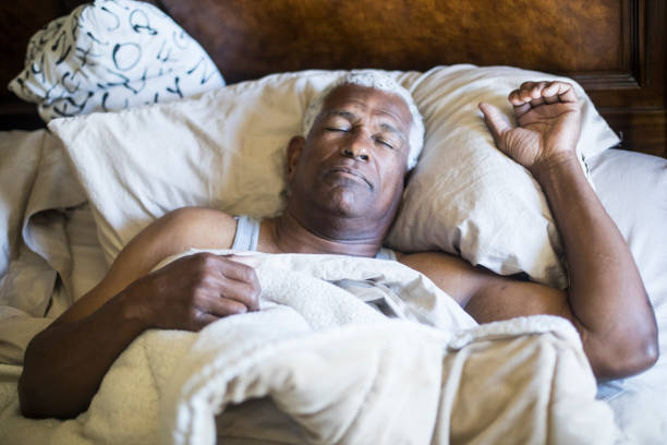 istock Senior Black Man Sleeping and Waking Up 937615940