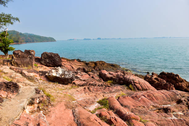 istock The sea and the rocks red. 937625352