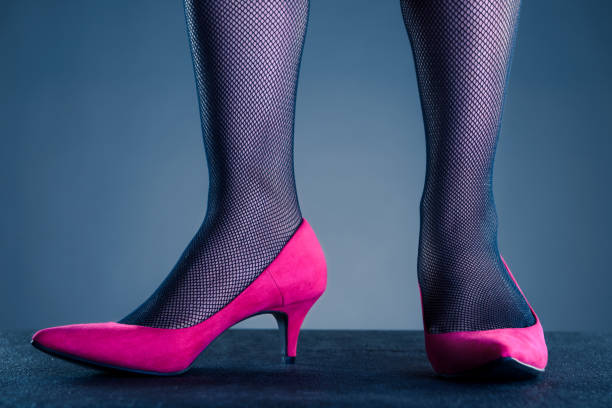 istock woman wearing pink high heels 937625416