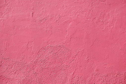 Painted pink wall texture, textured background