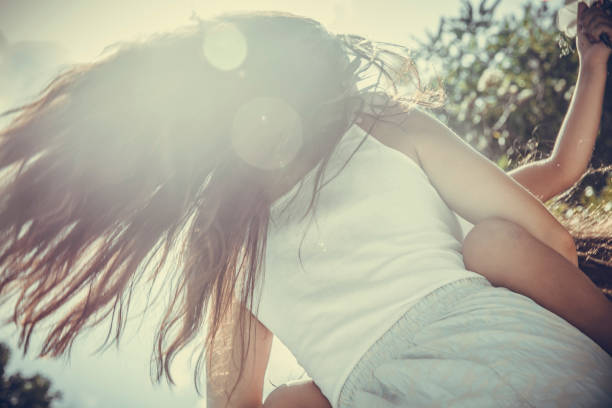 Daughter and mother are dancing in nature